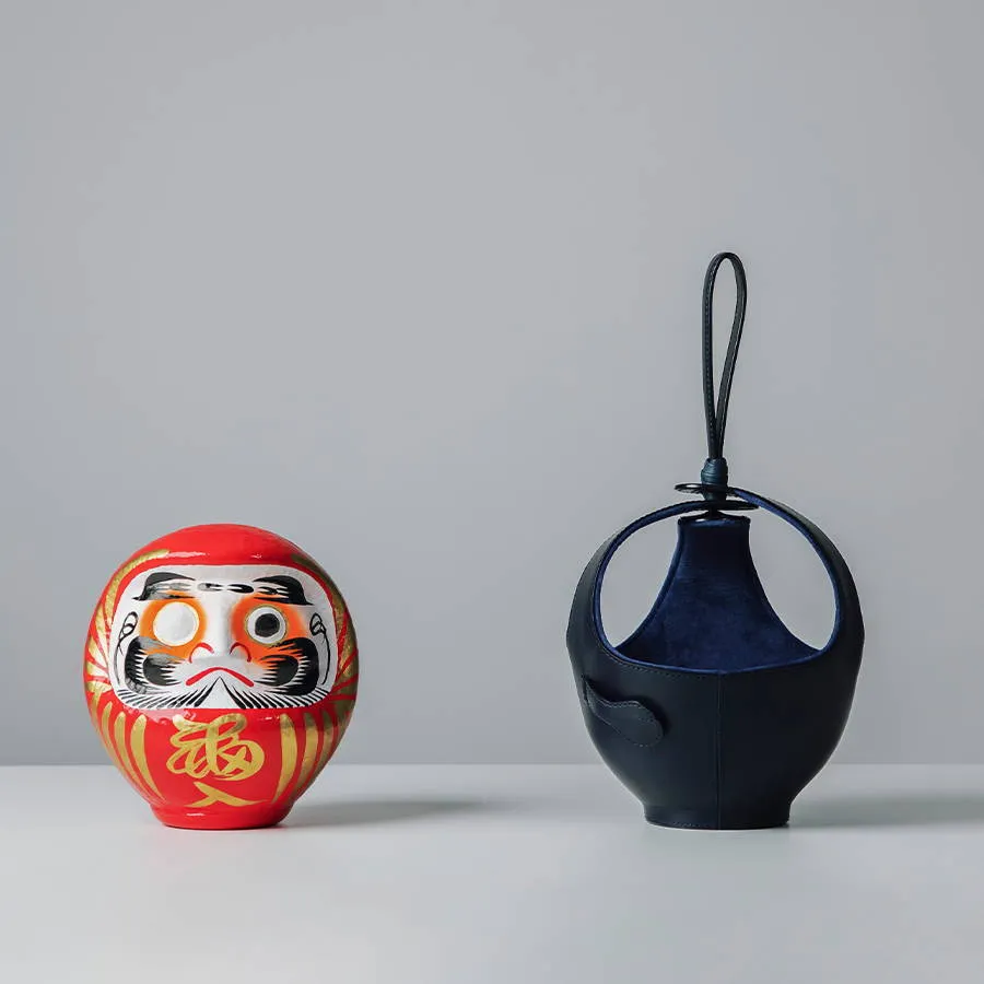 不倒翁「袋」著走